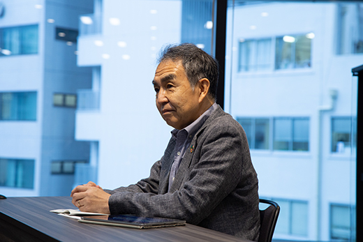 江村克己(NECフェロー) 1982年、光通信技術の研究者としてNECへ入社。以降、中央研究所長や執行役員、CTOを経て現職